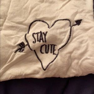 “Stay cute” shirt with black trim